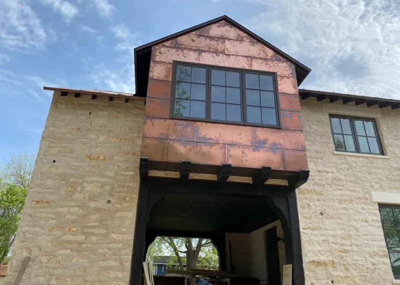 Copper metal panel facade on a stone building for Skylight Installation in Shepherdsville